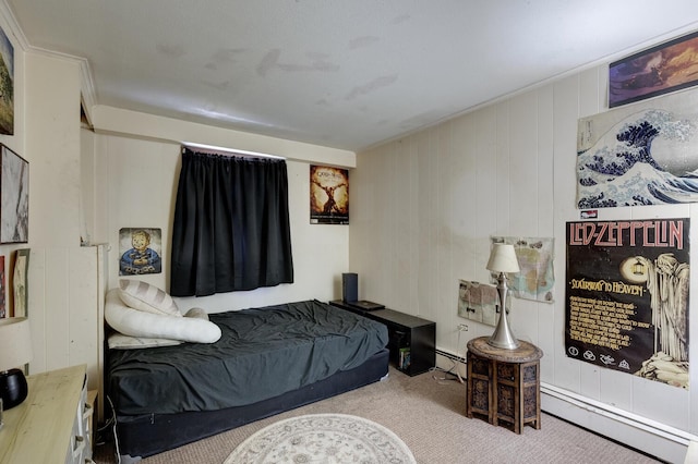 bedroom with carpet flooring, baseboard heating, and a baseboard radiator