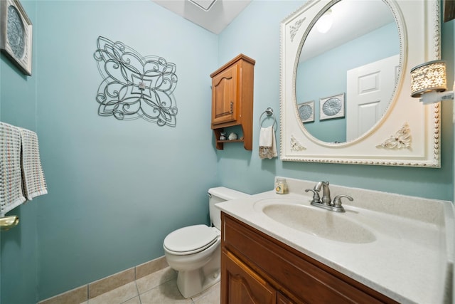 half bathroom with vanity, tile patterned flooring, and toilet
