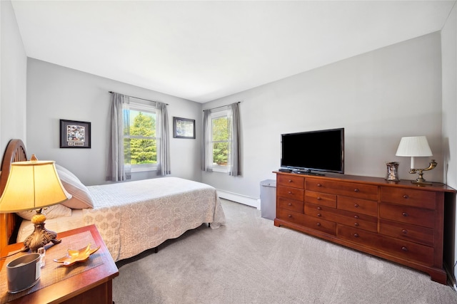 carpeted bedroom with baseboards and a baseboard radiator