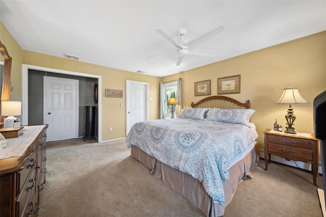 bedroom with light colored carpet, a ceiling fan, baseboards, and visible vents