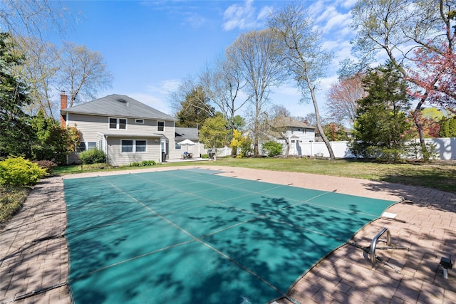 view of pool with a fenced backyard