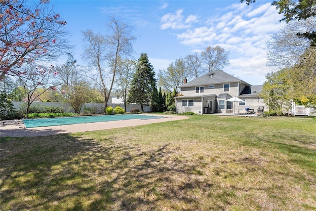 view of yard with a fenced in pool, a patio area, and fence