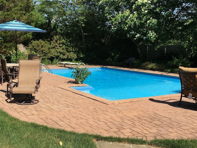 outdoor pool featuring a patio area