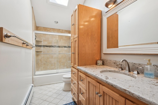 full bathroom with combined bath / shower with glass door, a baseboard heating unit, toilet, tile patterned floors, and vanity