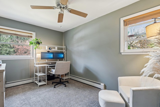 home office with carpet, ceiling fan, and a baseboard heating unit