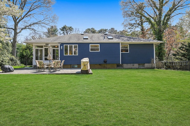 back of house with a patio, fence, and a lawn