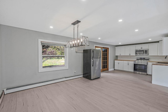 kitchen featuring stainless steel appliances, baseboard heating, white cabinets, light wood-style floors, and recessed lighting