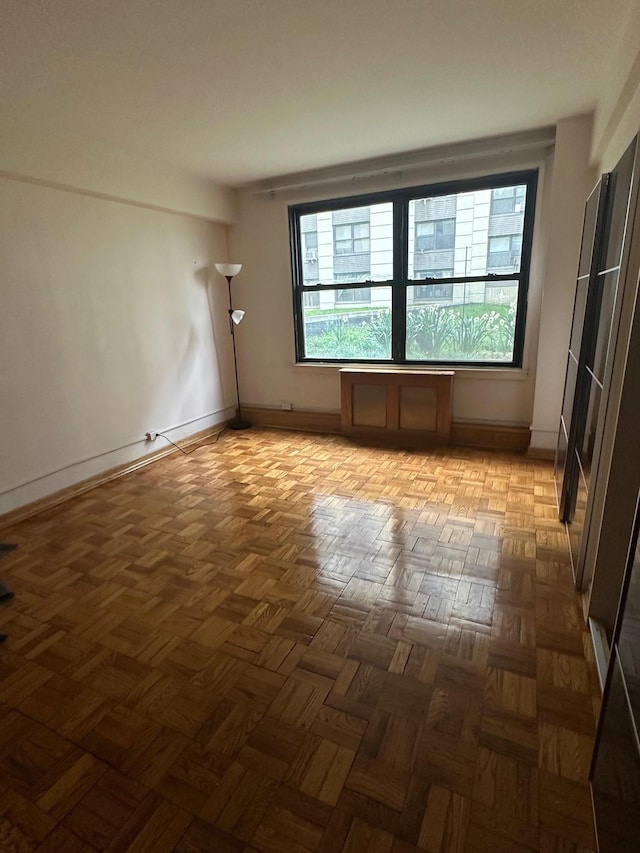 98-22 63rd Dr Unit 1E, Rego Park, NY 11374 - unfurnished room featuring baseboards