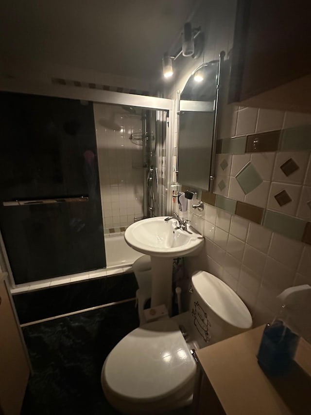 98-22 63rd Dr Unit 1E, Rego Park, NY 11374 - full bathroom with a sink, tiled shower / bath, toilet, and tasteful backsplash