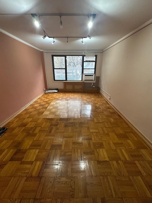 98-22 63rd Dr Unit 1E, Rego Park, NY 11374 - spare room featuring baseboards, ornamental molding, and cooling unit