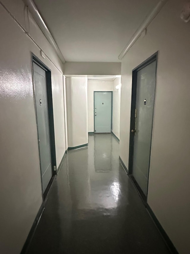 98-22 63rd Dr Unit 1E, Rego Park, NY 11374 - corridor with finished concrete flooring