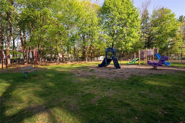 community playground featuring fence and a yard