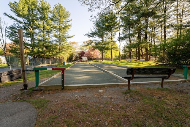 view of community featuring fence