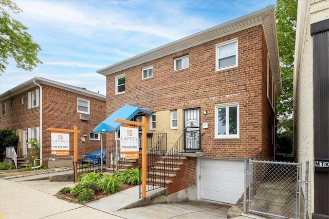 2533 Francis Lewis Blvd, Whitestone, NY 11358 - view of property with brick siding, a garage, concrete driveway, and fence