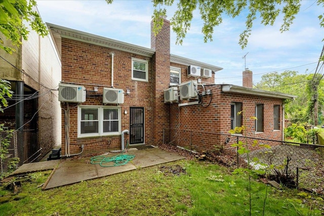 2533 Francis Lewis Blvd, Whitestone, NY 11358 - rear view of house with a chimney, brick siding, and fence