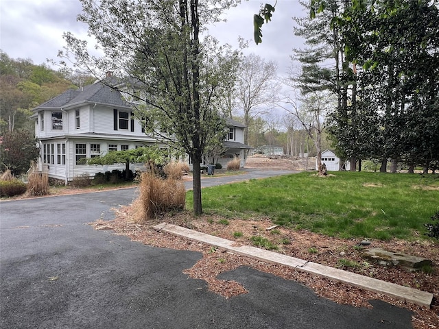 exterior space featuring aphalt driveway
