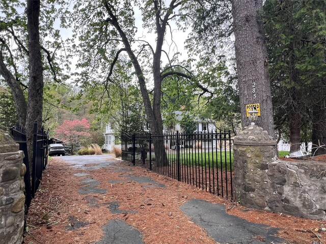 view of street featuring aphalt driveway