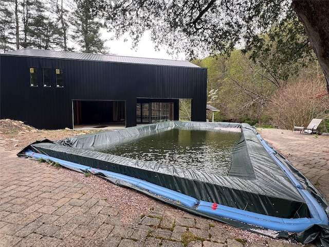 entry to storm shelter with a patio