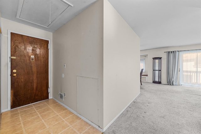 entryway featuring baseboards, visible vents, and a wealth of natural light
