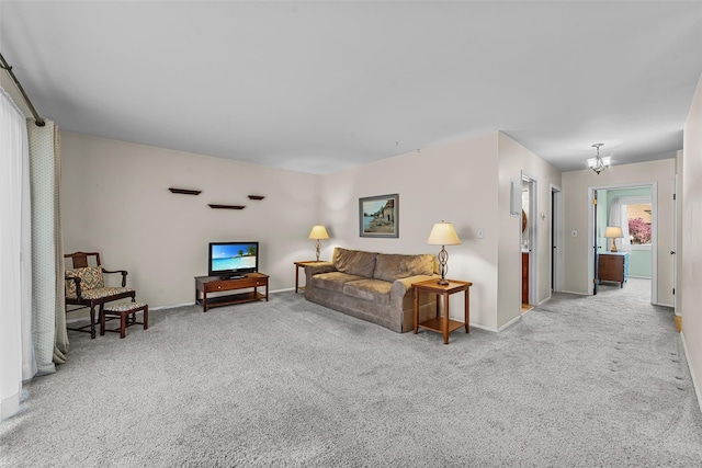 carpeted living area with baseboards