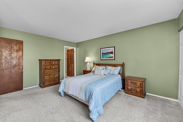 bedroom featuring baseboards and carpet flooring