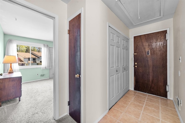 entrance foyer with baseboards, light tile patterned flooring, and visible vents
