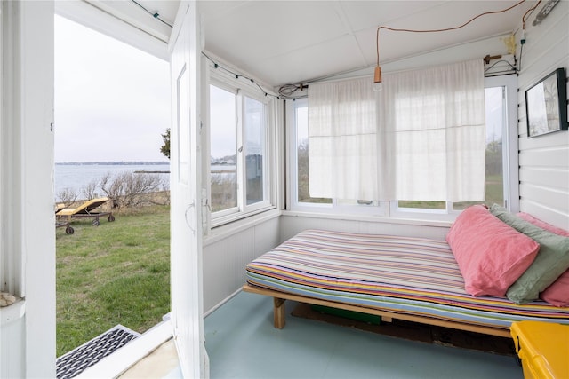 sunroom / solarium with a water view