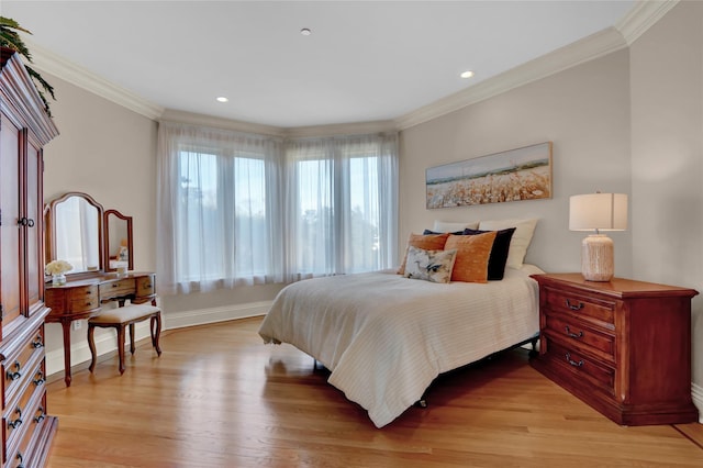 bedroom featuring crown molding, baseboards, recessed lighting, and light wood-type flooring
