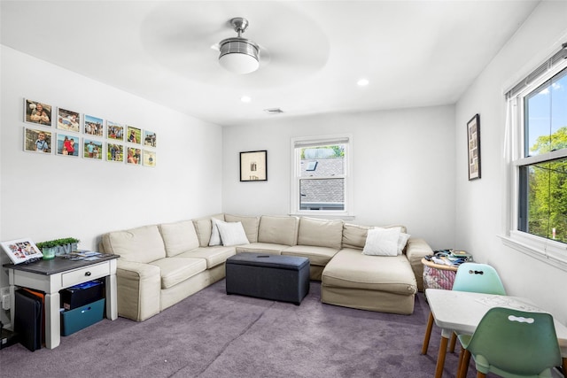 living room featuring a wealth of natural light, carpet flooring, recessed lighting, and visible vents