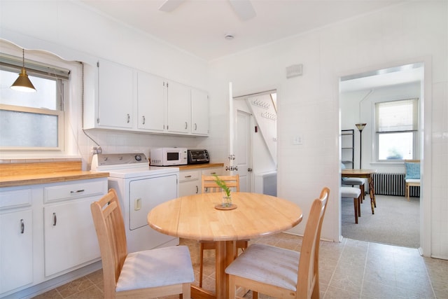 26 S Eckar St, Irvington, NY 10533 - dining area featuring washer / dryer, radiator, and ceiling fan