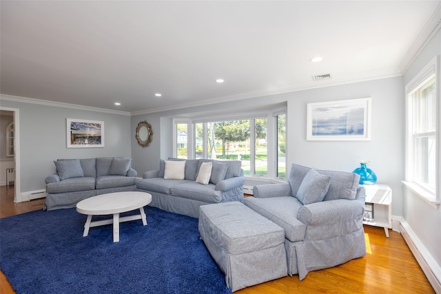 living room featuring recessed lighting, a baseboard heating unit, light wood-style floors, ornamental molding, and visible vents