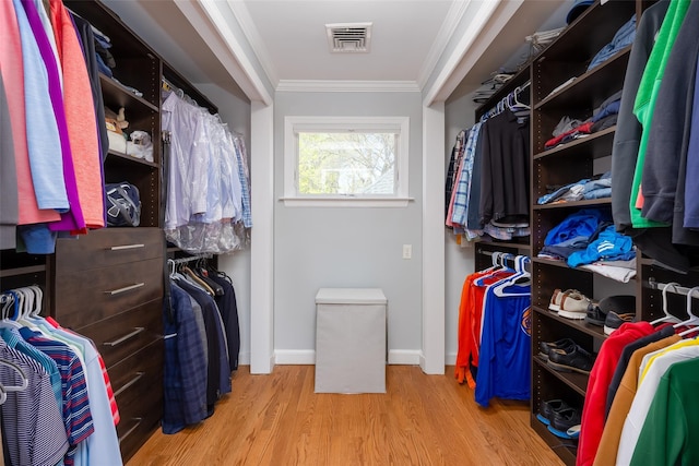 spacious closet featuring light wood finished floors and visible vents
