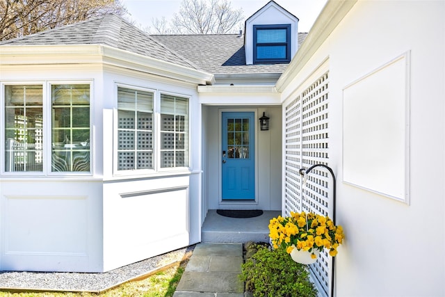 property entrance with roof with shingles