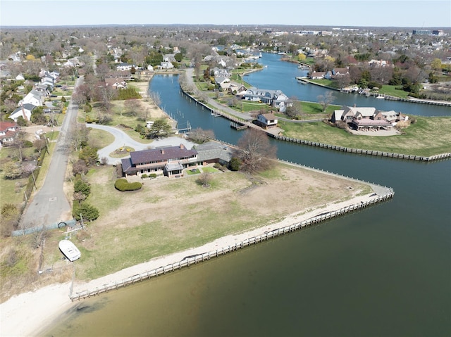 bird's eye view featuring a water view and a residential view