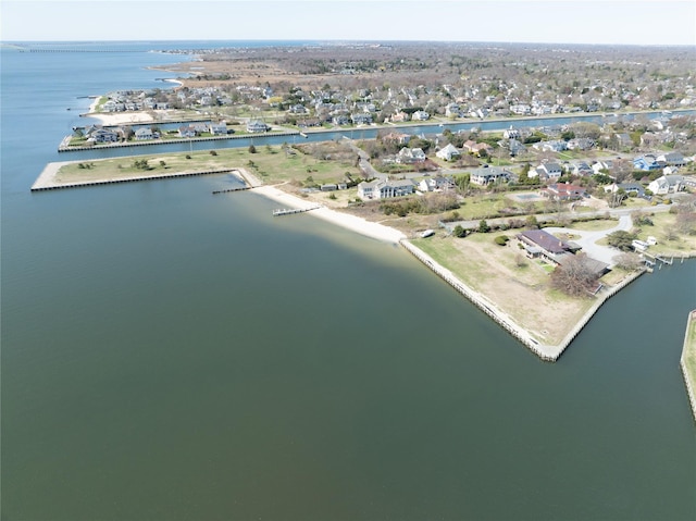 drone / aerial view with a water view and a residential view