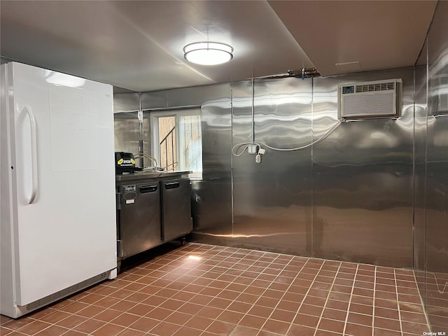 18-24 College Point Blvd, College Point, NY 11356 - kitchen with freestanding refrigerator, a wall mounted AC, and tile patterned floors