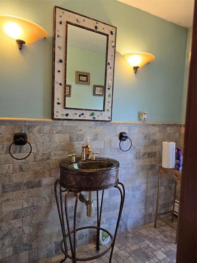 22 Lake Rd, Great Neck, NY 11020 - bathroom featuring a sink, wainscoting, and tile walls