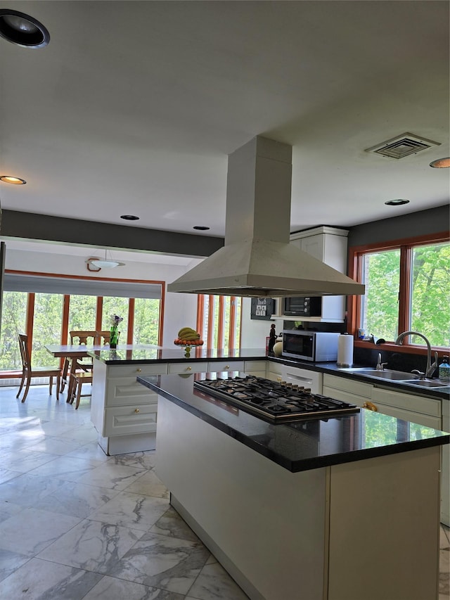 22 Lake Rd, Great Neck, NY 11020 - kitchen featuring dark countertops, a sink, stainless steel appliances, white cabinetry, and island exhaust hood