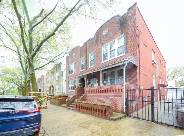 2250 E 23rd St, Brooklyn, NY 11229 - view of front facade with fence and brick siding