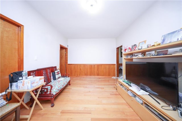 2250 E 23rd St, Brooklyn, NY 11229 - sitting room with wood walls, wood finished floors, and a wainscoted wall