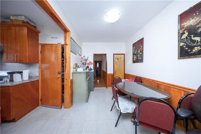 2250 E 23rd St, Brooklyn, NY 11229 - dining space featuring wooden walls and wainscoting
