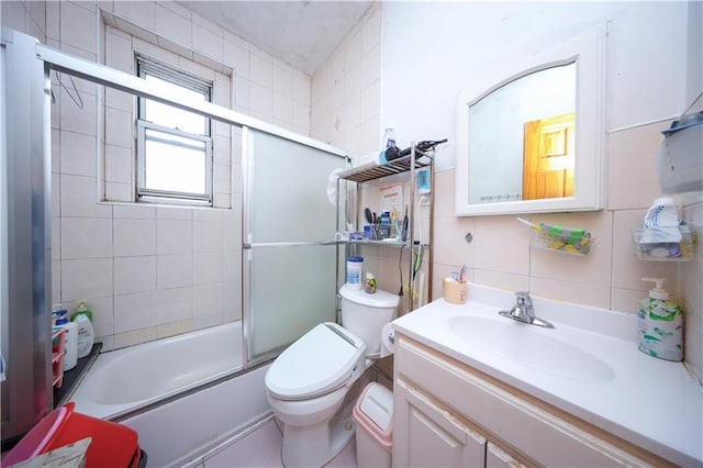 2250 E 23rd St, Brooklyn, NY 11229 - bathroom with tile walls, vanity, toilet, enclosed tub / shower combo, and backsplash
