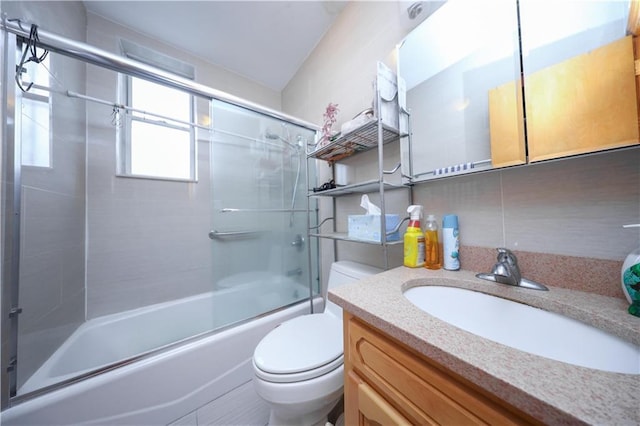 2250 E 23rd St, Brooklyn, NY 11229 - full bath featuring shower / bath combination with glass door, backsplash, toilet, and vanity