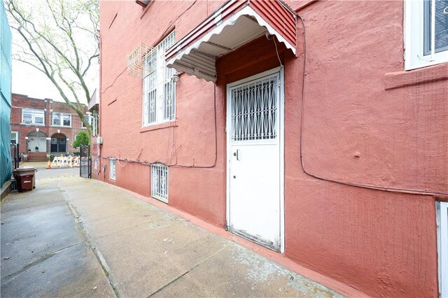 2250 E 23rd St, Brooklyn, NY 11229 - view of exterior entry with stucco siding