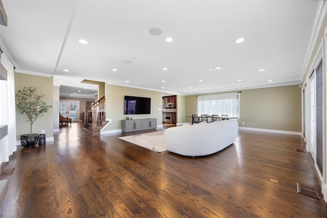 83 Central Ave, Amityville, NY 11701 - living room featuring crown molding, recessed lighting, and stairway