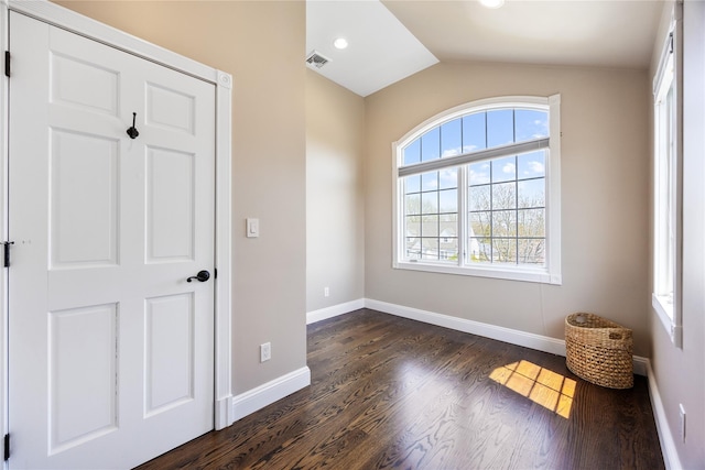 83 Central Ave, Amityville, NY 11701 - spare room with lofted ceiling, visible vents, baseboards, recessed lighting, and dark wood finished floors