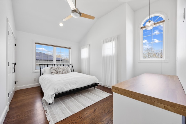83 Central Ave, Amityville, NY 11701 - bedroom featuring dark wood-style floors, multiple windows, and vaulted ceiling