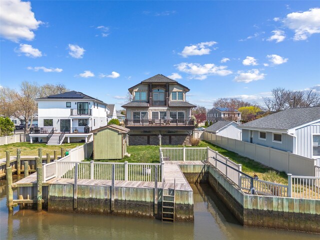 83 Central Ave, Amityville, NY 11701 - dock area featuring a fenced backyard and a water view