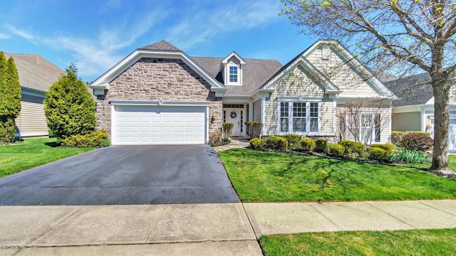 69 Samantha Cir Unit 69, Westhampton, NY 11977 - view of front of house with a garage, driveway, a front yard, and stone siding