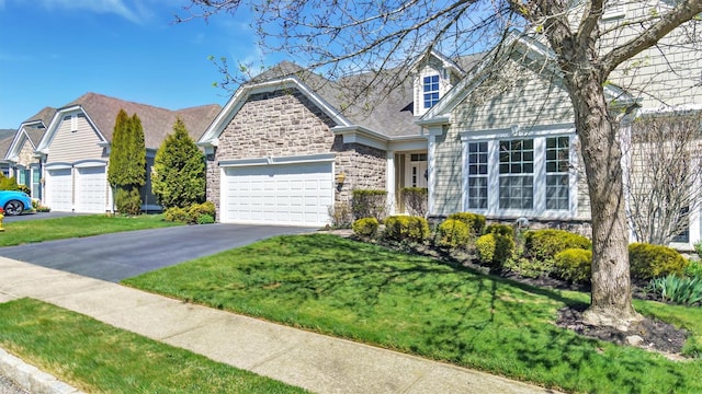 69 Samantha Cir Unit 69, Westhampton, NY 11977 - view of front of property with a garage, aphalt driveway, a front lawn, and stone siding